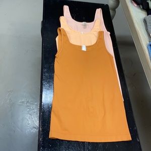 Lot of 3 NikiBiki tank tops. NWOT. Pink, peach, cereal.